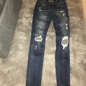 Buckle black ripped jeans